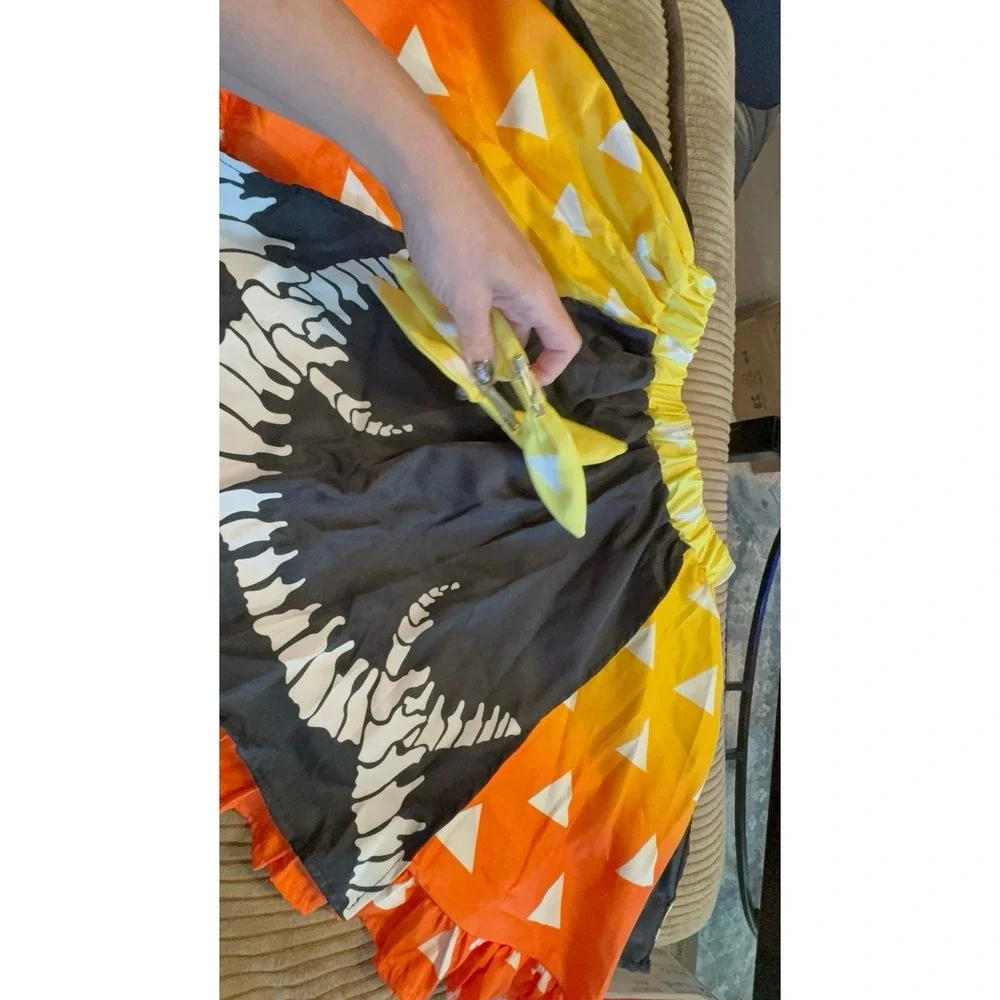 Like new condition women's size LARGE Halloween candy corn dinosaur skirt